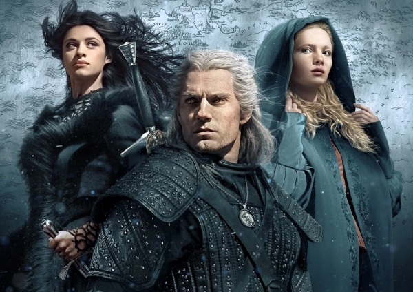 Ciri, Yennefer, and Geralt stand in front of a map of The Continent